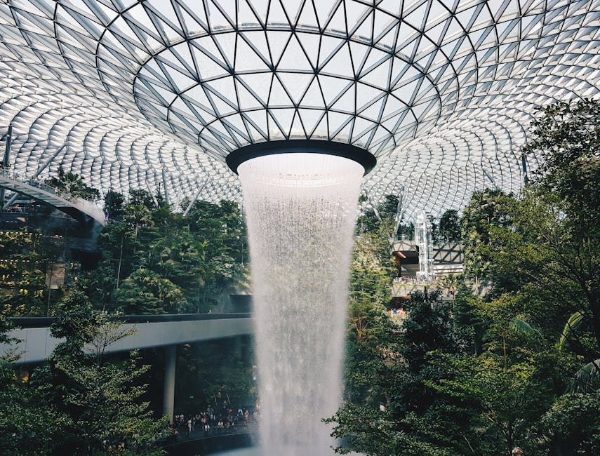 Stunning view of the indoor waterfall at Jewel Changi Airport, Singapore's architectural marvel.