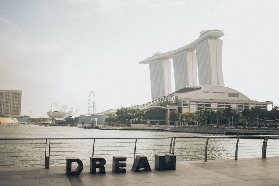 Scenic view of Marina Bay Sands with 'Dream' sculpture at Singapore waterfront.